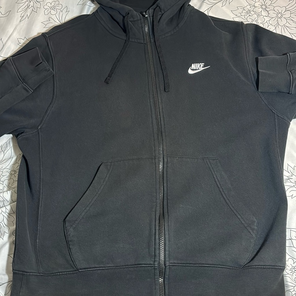 This is a black Nike zip up medium in men’s